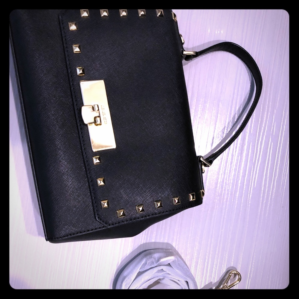 Michael Kors black hand bag with gold grommets